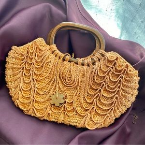 Buji Baja handbag/purse with wooden handles and wooden flower tie detail